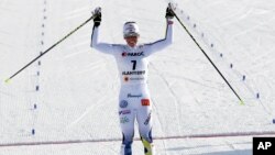 Sweden's Charlotte Kalla celebrates as she finishes third in the women's skiathlon 7.5 km classic at the 2017 Nordic Skiing World Championships in Lahti, Finland, Feb. 25, 2017. 