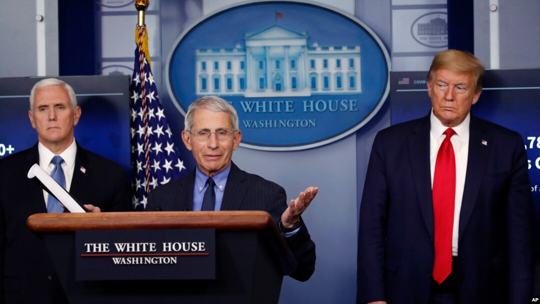 FILE - President Donald Trump and Vice President Mike Pence listen as Dr. Anthony Fauci, director of the National Institute of Allergy and Infectious Diseases, speaks about the coronavirus in the James Brady Press Briefing Room of the White House in Washi