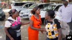 A pregnant Sharon Andisi, center, arrives outside the Pumwani Maternity Hospital, Jan. 9, 2017, only to be turned away because of a strike by state doctors, in Nairobi, Kenya. Such scenes have become frequent across Kenya as the doctors' strike stretches into a second month.