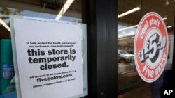 A sign is posted on a closed store, April 23, 2020, in North Miami, Fla. A half million Floridians applied for unemployment benefits last week, as a statewide task force continues studying when businesses shuttered because of the coronavirus can reopen.