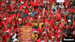 FILE - South African union members march during a nationwide protest against a proposed minimum wage in Cape Town, South Africa, April 25, 2018.