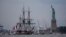 FILE - The tall ship Hermione, a replica of the 18th-century frigate that carried news of French support for the American revolution, passes the Statue of Liberty in New York, July 4, 2015.