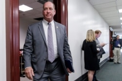 FILE - In this March 28, 2017, file photo, Rep. Ted Yoho, R-Fla., leaves a closed-door strategy session at the Capitol in Washington.