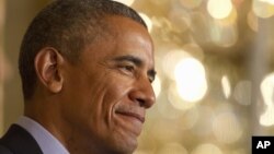 President Barack Obama smiles during a joint news conference with Brazilian President Dilma Rousseff in the East Room of the White House in Washington, June 30, 2015. 