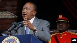 FILE - Kenyan President Uhuru Kenyatta delivers a speech at the Nyayo Nationa Stadium in Nairobi. 