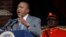 FILE - Kenyan President Uhuru Kenyatta delivers a speech at the Nyayo National Stadium in Nairobi. 