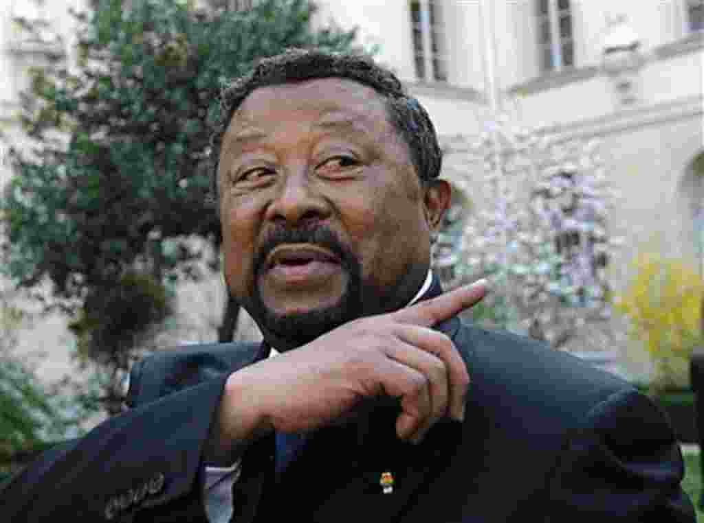 African Union Commission Chairman Jean Ping arrives to address media before making a statement on Libya to students, in Paris, March 24, 2011