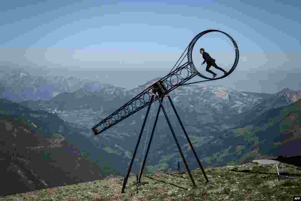 Swiss acrobat Ramon Kathriner performs with the &quot;Wheel of The Death&quot; during the Glacier 3000 Air show an event marking the reopening of the Alpine facilities above Les Diablerets following the lockdown due to the COVID-19 outbreak.