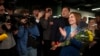 Moldova's President Maia Sandu celebrates with supporters as preliminary results are announced for the presidential election runoff in Chisinau, Moldova, Nov. 3, 2024.