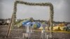 Wreaths and floral installations stand next to piles of wreckage where an Ethiopian Airlines Boeing 737 Max 8 crashed shortly after takeoff on Sunday, killing all 157 on board.