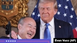 SoftBank Group CEO Masayoshi Son smiles with President-elect Donald Trump during a news conference at Mar-a-Lago, Monday, Dec. 16, 2024, in Palm Beach, Florida. (AP Photo/Evan Vucci)