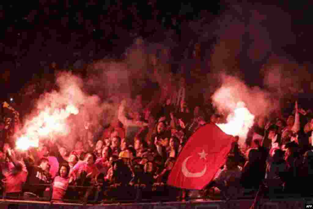 Turkish soccer fans set off fireworks during the friendly international soccer match Netherlands against Turkey at ArenA stadium in Amsterdam, Netherlands, Wednesday Nov. 17, 2010. (AP Photo/Peter Dejong)