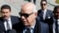 Mohammed Chouaib, head of delegation from the UN-recognized government in the eastern city of Tobruk, speaks to the media as he arrives at the Palais des Congres of Skhirate 30 km south of Rabat, March 20, 2015.
