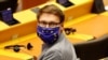 European Parliament member Moritz Korner, wearing a face mask with the EU flag, attends a plenary session on a new proposal for the EU's joint 2021-27 budget and an accompanying economic stimulus measure, in Brussels, May 27, 2020.