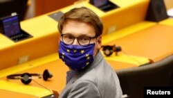 European Parliament member Moritz Korner, wearing a face mask with the EU flag, attends a plenary session on a new proposal for the EU's joint 2021-27 budget and an accompanying economic stimulus measure, in Brussels, May 27, 2020.