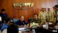 Phay Siphan, a gov't spokesperson along with Chhum Socheat, a spokesperson of the ministry of defense during a rare media tour at Ream Naval Base in Preah Sihanouk province, Cambodia, Friday, July 26, 2019. (Sophat Sophat/VOA Khmer)