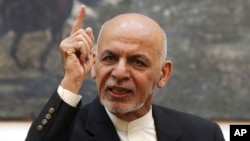 FILE - Afghan President Ashraf Ghani speaks during a press conference at the presidential palace in Kabul, Afghanistan, July 15, 2018. 