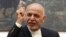 FILE - Afghan President Ashraf Ghani speaks during a press conference at the presidential palace in Kabul, Afghanistan, July 15, 2018. 