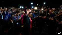 FILE — Britain's Prime Minister Rishi Sunak waves as he leaves the stage after his speech during the Conservative Party annual conference at Manchester Central convention complex, Oct. 4, 2023.