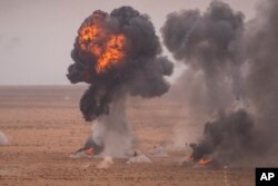 FILE—A target is hit with artillery fire as U.S and Moroccan military forces take part in the 20th edition of the African Lion military exercise, in Tantan, south of Agadir, Morocco, May 31, 2024.