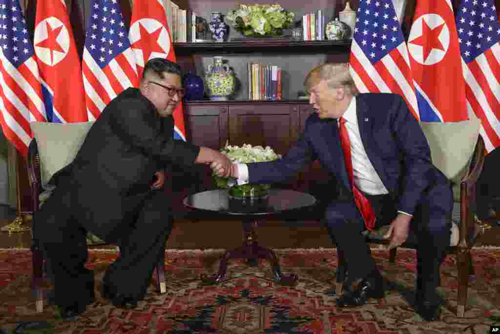 North Korea leader Kim Jong Un and U.S. President Donald Trump during their first meeting at the Capella resort on Sentosa Island Tuesday, June 12, 2018 in Singapore. (AP Photo/Evan Vucci)