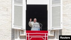 Pope Francis leads the Regina Coeli prayer from his window at St. Peter's Square at the Vatican, April 25, 2021. REUTERS/Remo Casilli