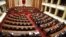 Albanian Lawmakers take part in an parliament session as the seats of the main opposition Democratic party (L) are empty, in Tirana, April 11, 2017. 
