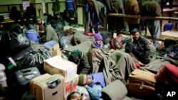 A Congolese girl, displaced by recent fighting in North Kivu, holds a doll at the child friendly space (CFS) within Mugunga III camp for the internally displaced people near Goma, eastern Democratic Republic of Congo.