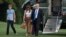President Donald Trump, first lady Melania Trump, and their son Barron Trump walk from Marine One across the South Lawn to the White House in Washington, June 11, 2017.