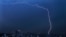 A bolt of lightning strikes during an early morning storm in Mexico City, June 22, 2020.
