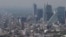 Haze hangs over Mexico City at midday, March 15, 2016. Despite the heavy downpours that come each rainy season, Mexico City has long struggled with providing enough water for some 21 million people in the greater metropolitan area.