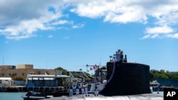 FILE - The USS Illinois returns to Joint Base Pearl Harbor-Hickam from a deployment, Sept. 13, 2021. Australia is investing in U.S. nuclear-powered subs because of a changed strategic environment, its prime minister said Sept. 16, 2021.