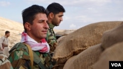 Iranian Kurdish fighters stand watch on the Bashiqa front lines, Nov. 2, 2016. Last week, there were high Kurdish casualties during an offensive on the Islamic State-held town 30 kilometers from Mosul. (J. Dettmer/VOA)