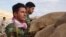 Iranian Kurdish fighters stand watch on the Bashiqa front lines, Nov. 2, 2016. Last week, there were high Kurdish casualties during an offensive on the Islamic State-held town 30 kilometers from Mosul. (J. Dettmer/VOA)