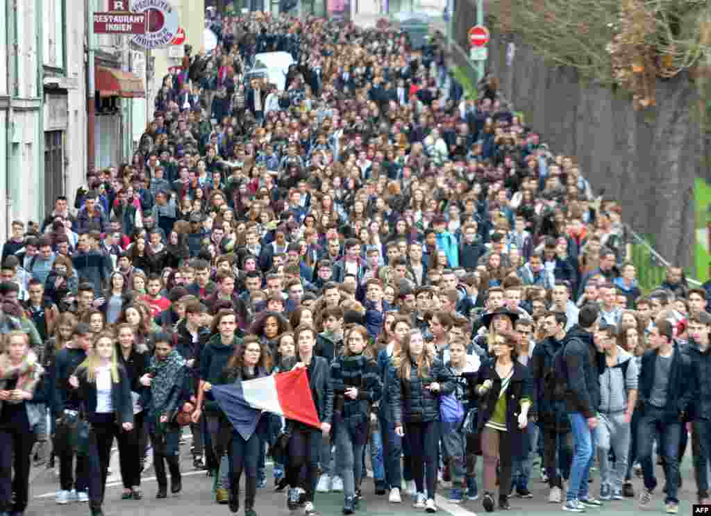 High school students march past during a demonstration&nbsp; on the streets in Le Mans, north-western France, to pay tribute to victims of the attacks claimed by Islamic State which killed at least 129 people and left more than 350 injured on Nov. 13.