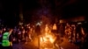 Demonstrators burn garbage in Oakland, Calif., on May 29, 2020, while protesting the Monday death of George Floyd, a handcuffed black man in police custody in Minneapolis. 