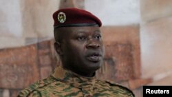 FILE - Burkina Faso military leader Lieutenant Colonel Paul-Henri Damiba speaks during a news conference with Ivory Coast's President Alassane Ouattara at the presidential palace in Abidjan, Ivory Coast, Sept. 5, 2022.