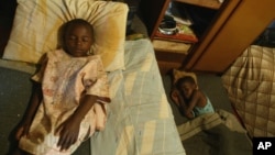 FILE - Children take an afternoon nap at an orphanage in Harare, Zimbabwe, May 26, 2006. One of the biggest problems caused by AIDS in Africa is the number of children who are being orphaned as the disease kills their parents and guardians.