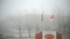 FILE - Fog shrouds a Tyson plant in Burbank, Washington, Dec. 26, 2013. Tyson Foods suspended operations Wednesday at an Iowa plant over a massive coronavirus outbreak.