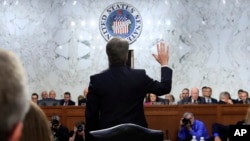 FILE - Supreme Court nominee Brett Kavanaugh is sworn in before the Senate Judiciary Committee on Capitol Hill in Washington, Sept. 4, 2018, to begin his testimony in his confirmation hearing.