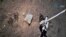 This picture taken on Dec. 2, 2020 and released on Dec. 3, 2020 by the China National Space Administration (CNSA) via CNS shows the Chang'e-5 lunar probe gathering samples on the moon.
