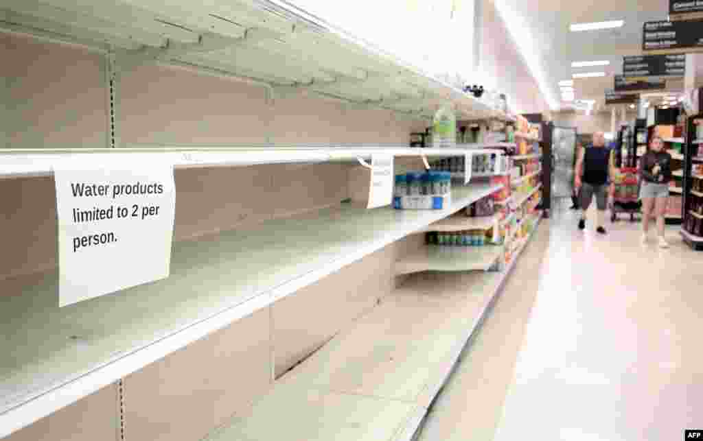 Shelves in a local grocery store have been cleared out of bottled water ahead of Hurricane Milton's expected mid-week landfall in Kissimmee, Florida, Oct. 7, 2024.