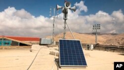 Loud speakers on the roof of the Petra Authority building were used on Nov. 9 to warn of flash floods, in Petra, Jordan.