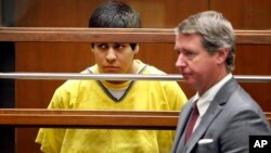 FILE - Andrew Garcia, left, appears in Los Angeles Superior Court with a public defender, Jan. 12, 2015, as one of four defendants charged in connection with the 2014 beating death of USC graduate student Xinran Ji during an attempted robbery. Garcia was convicted June 8, 2017, of first-degree murder and sentenced Aug. 16 to life in prison without parole.