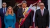 Venezuelan President Nicolas Maduro, center, stands with his wife, Cilia Flores, left, and National Assembly President Jorge Rodriguez after his swearing-in for a third term at the National Assembly in Caracas, Venezuela, Jan. 10, 2025.