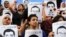 FILE - Protesters rally in support of three detained Al Jazeera journalists in front of the Press Syndicate in Cairo, Egypt, June 1, 2014.