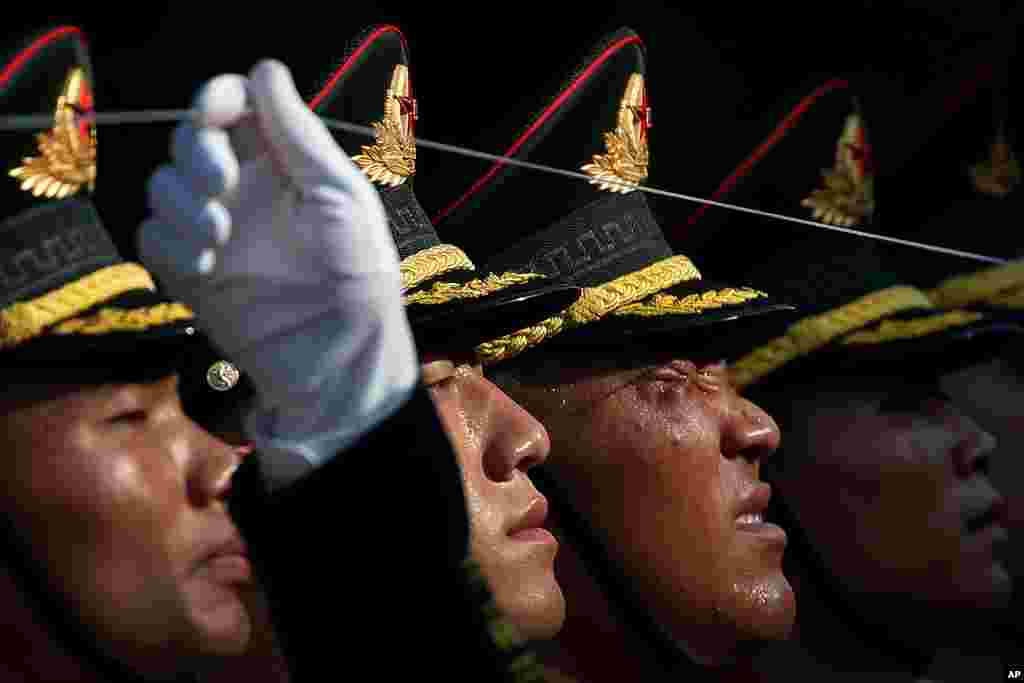 A member of the Chinese Honor Guard reacts as he and his comrades prepare for a welcome ceremony for visiting Colombia President Ivan Duque, at the Great Hall of the People in Beijing, China.