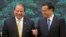 Pakistan's Prime Minister Nawaz Sharif (L) shares a light moment with Chinese Premier Li Keqiang before a signing ceremony held at the Great Hall of the People in Beijing July 5, 2013. REUTERS/Ng Han Guan/Pool (CHINA - Tags: POLITICS) - RTX11D76