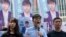 Hong Kong democratic activists, Joshua Wong, center, accompanied by Agnes Chow and pro-democracy lawmaker Au Nok-hin, announced plans to contest local elections, in Hong Kong, Sept. 28, 2019.