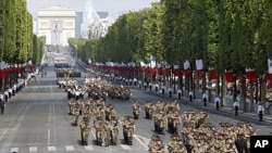 French army soldiers open the traditional Bastille Day parade on the Champs Elysees in Paris, July 14, 2011